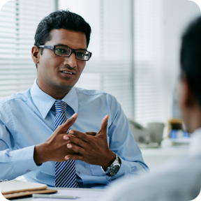 A businessman meets with a client. 
